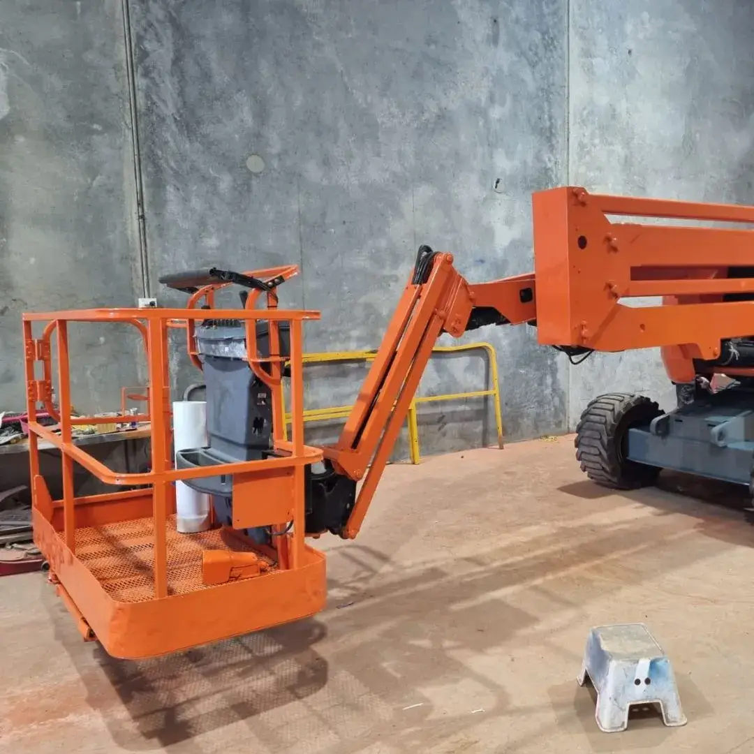 EWP boom basket in workshop during major inspection