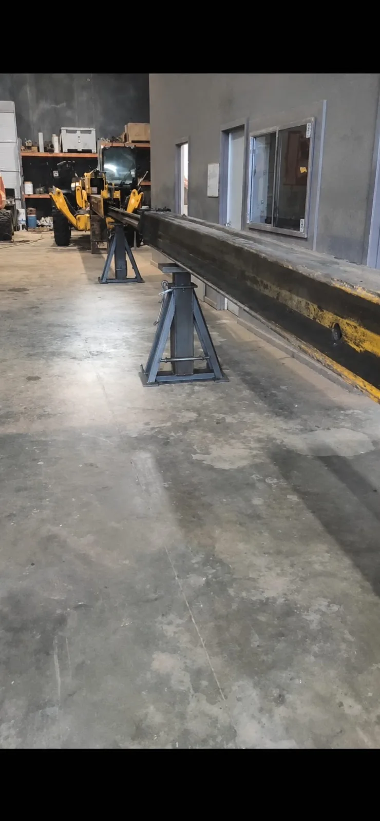 Boom removed and set on stands for full structural inspection