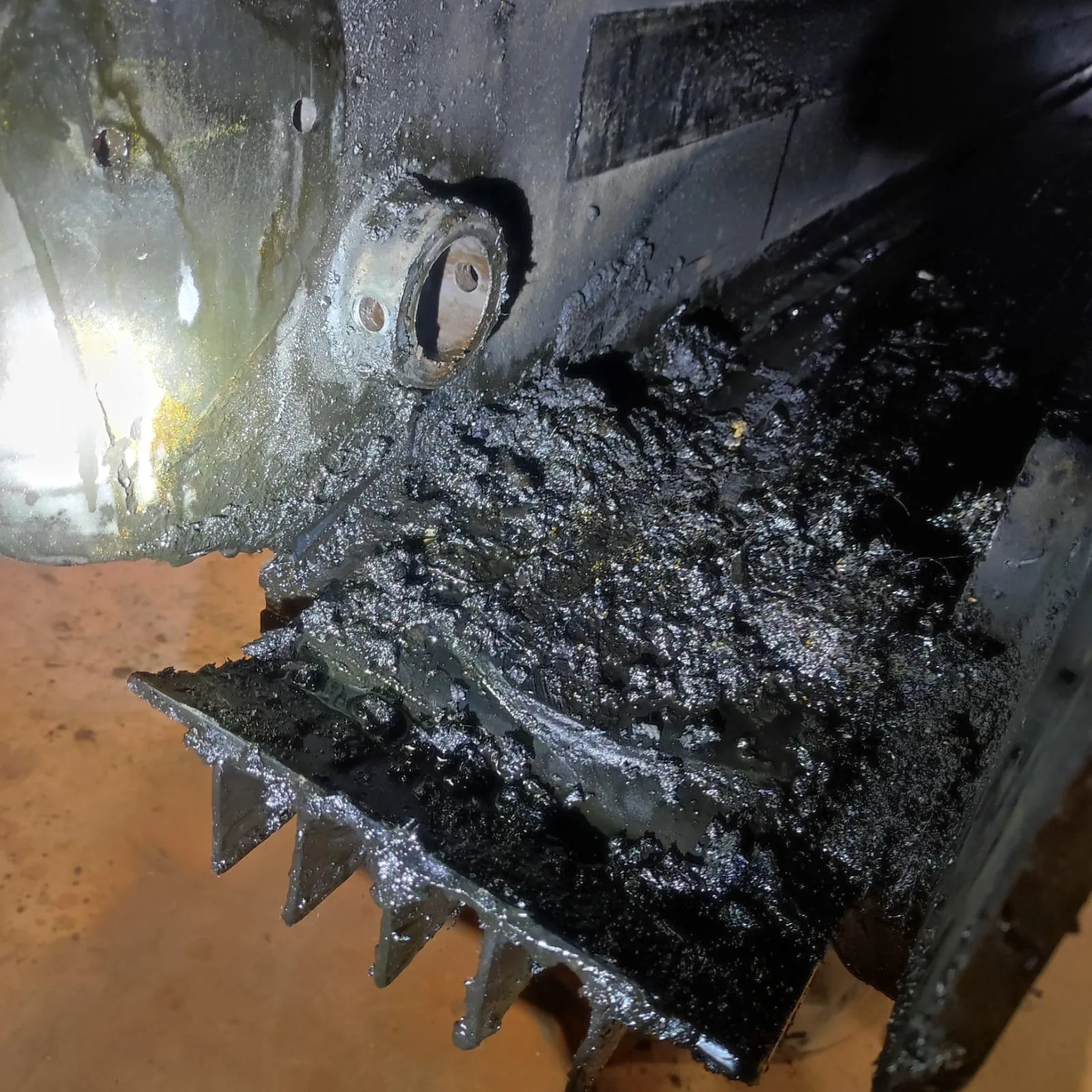 Heavy grease and contamination build-up on critical components